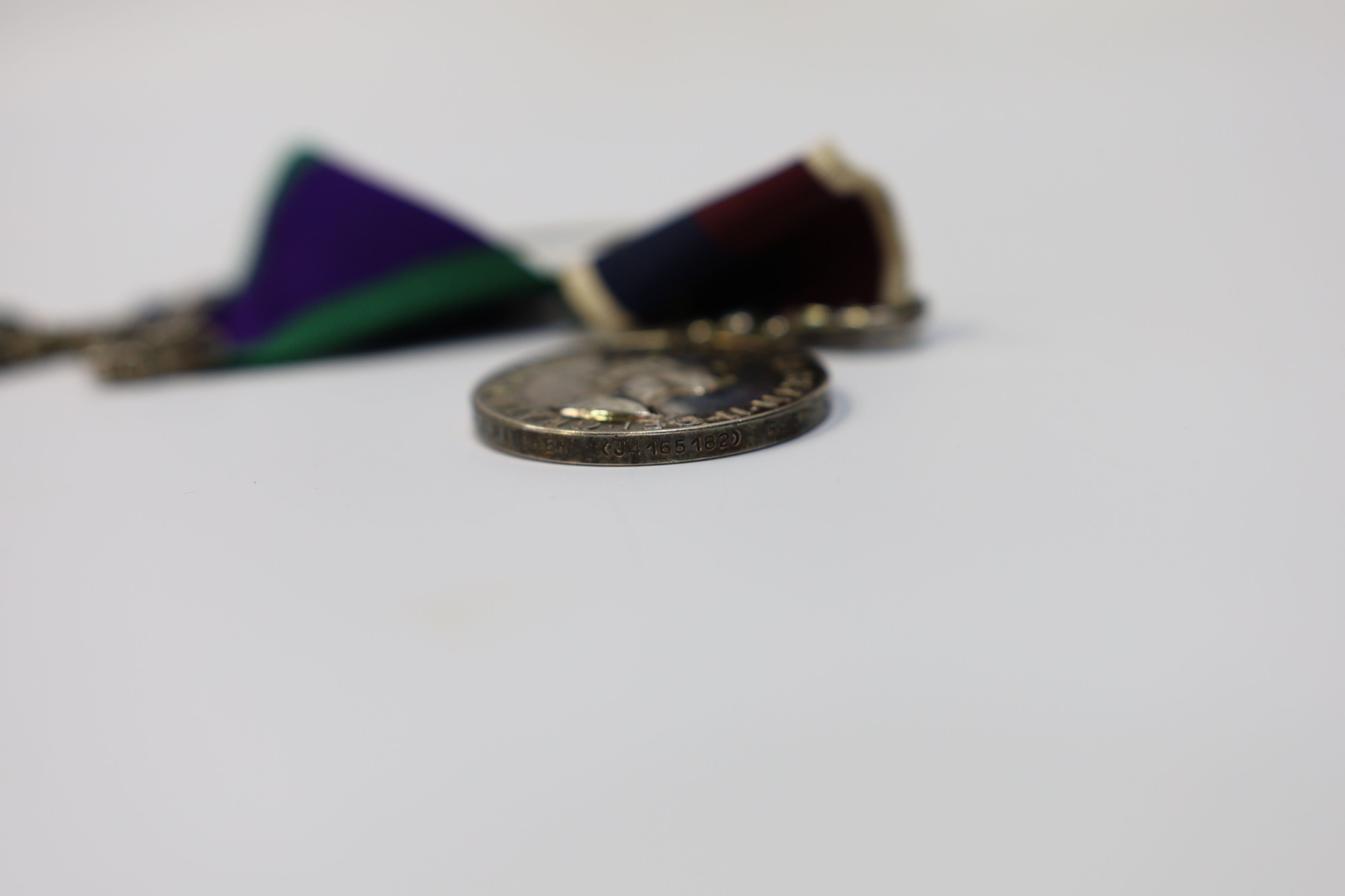 An ERII RAF medal pair awarded to Cpl. A.F.G. Pitcher RAF, comprising; a General Service Medal with a bar for Borneo and an RAF Long Service Medal, mounted on a common pin. Condition - fair to good